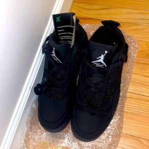 Black Cat Jordan 4’s